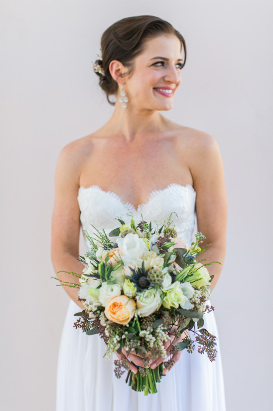 beautiful bride with bouquet by Judy McAuley @weddingchicks