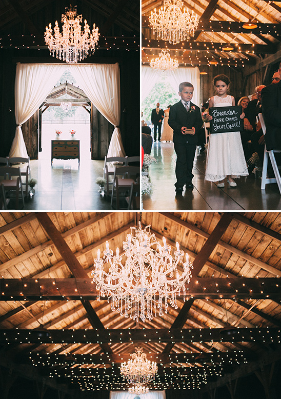 Elegant barn wedding decorated with chandeliers and lights