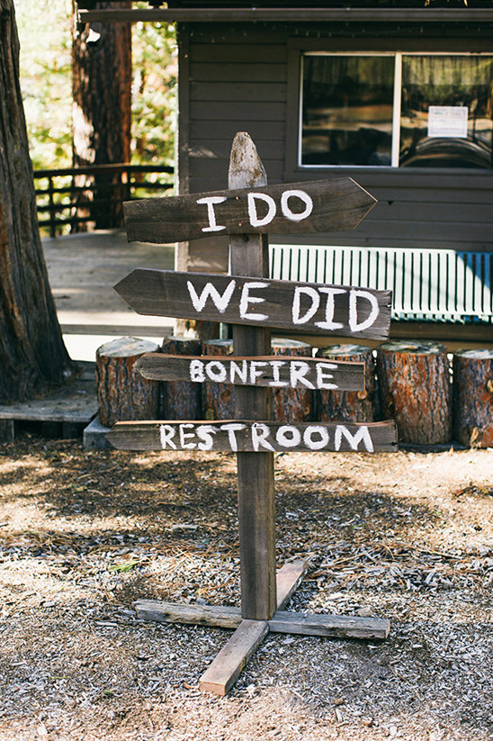Rustic wooden wedding sign with directions for guests