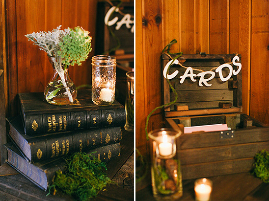 Rustic wedding decor with books, candles, and card box