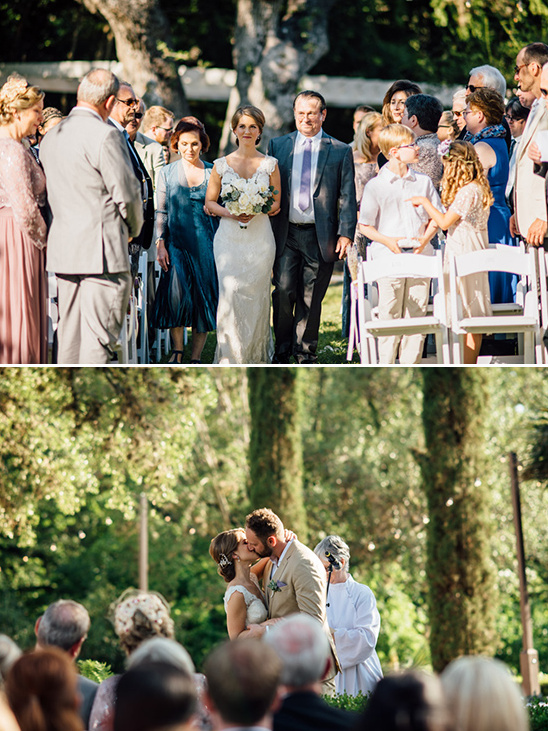 Bride walks down the aisle, then kisses groom at outdoor wedding