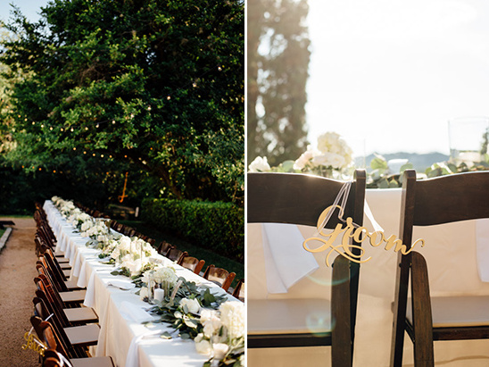 Outdoor wedding reception with elegant table settings and Groom sign