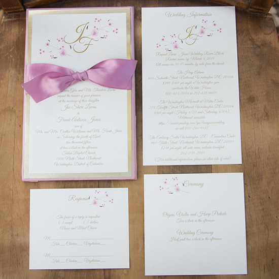 Elegant wedding invitation suite with floral accents and bow