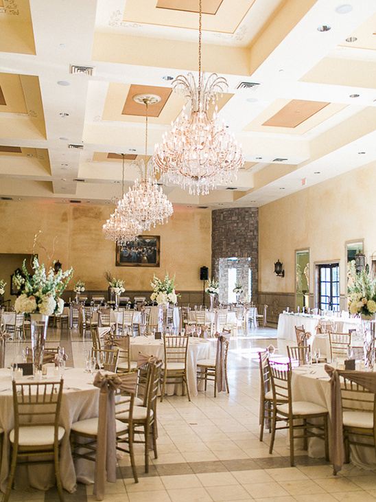 Elegant wedding reception hall decorated with chandeliers