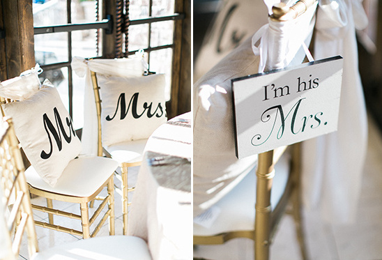 Wedding decor featuring Mr and Mrs pillows and sign