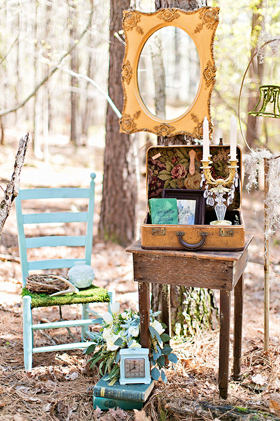 Bohemian outdoor decor with mirror, suitcase, and antique accents