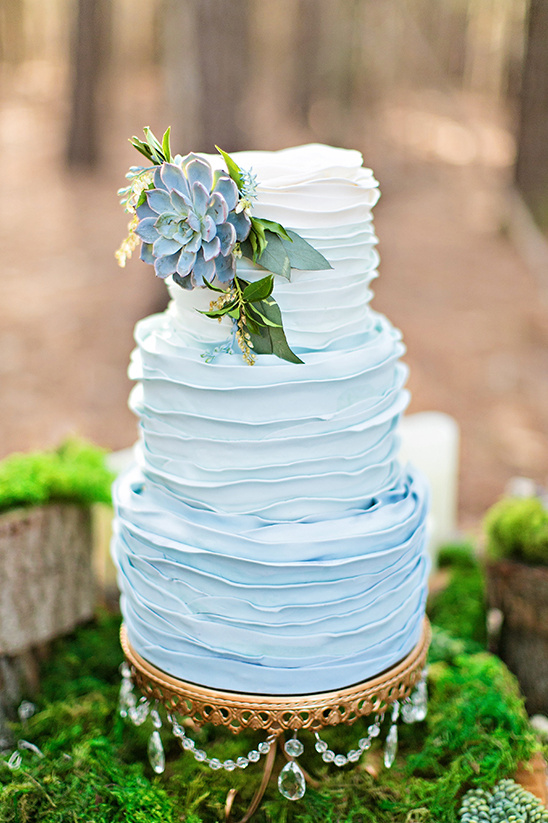 blue ombre ruffle wedding cake with succulent @weddingchicks