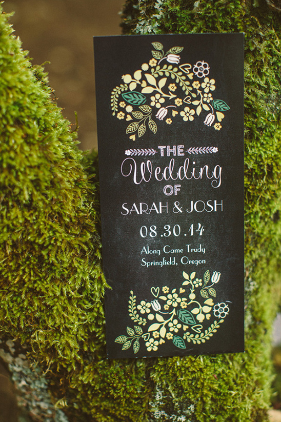 Wedding invitation on mossy branch for Sarah and Josh, Oregon