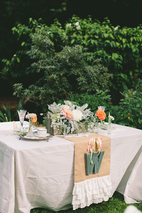 Elegant outdoor table setting with floral centerpiece decor