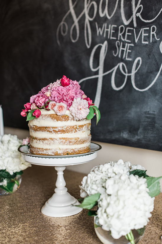flower topped naked cake @weddingchicks