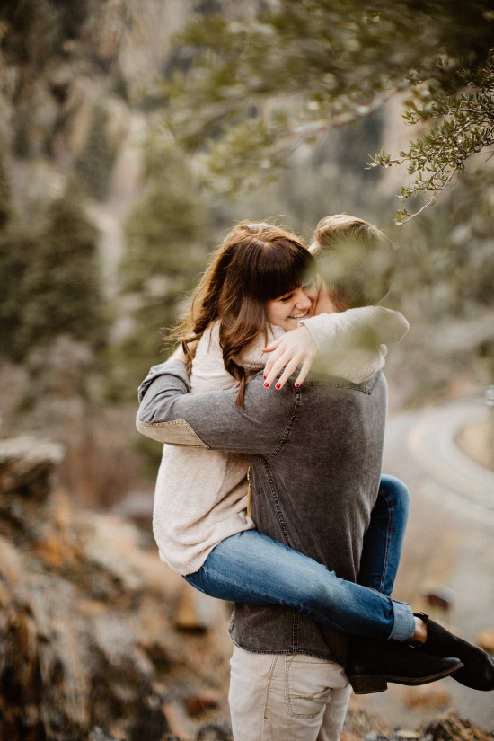 Couple embracing in a scenic outdoor setting
