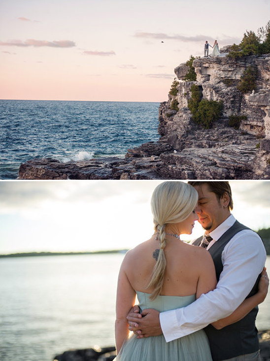 Newlyweds embrace romantically on a cliff by the sea