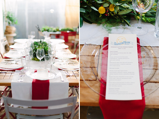 Elegant table setting with red accents and a Harvest Moon menu
