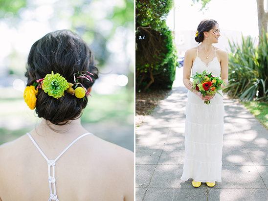 Bride with flower hair piece in white wedding dress