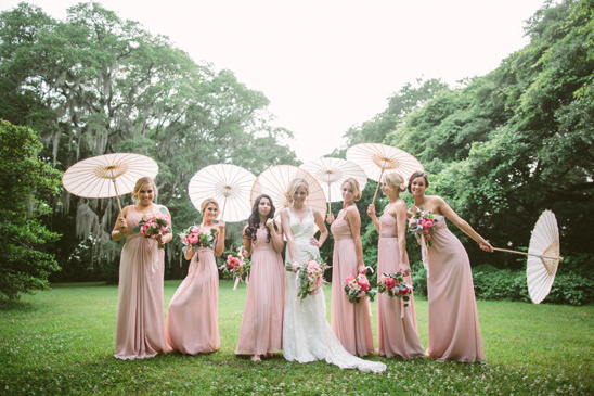 pink bridesmaids with parasols @weddingchicks