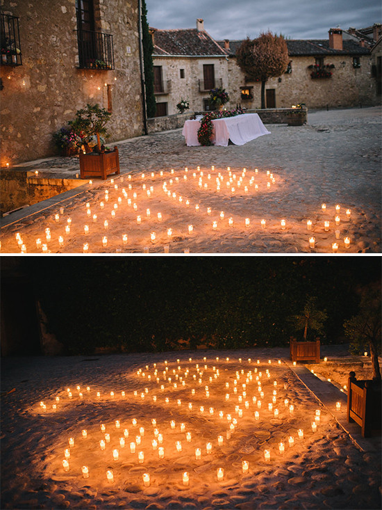 Romantic outdoor scene with many candles lighting the pathway