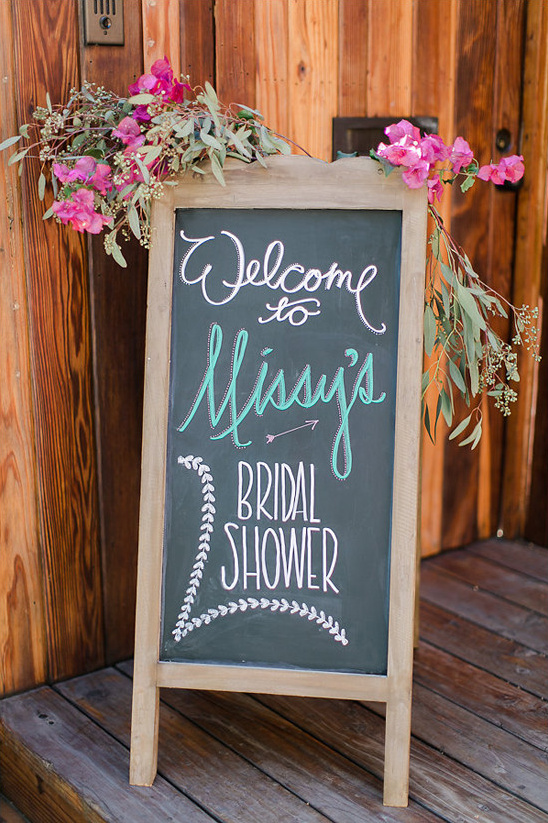 Welcome sign for Missys Bridal Shower decorated with flowers