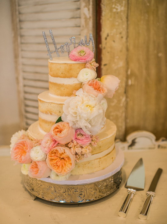flower accented naked cake @weddingchicks