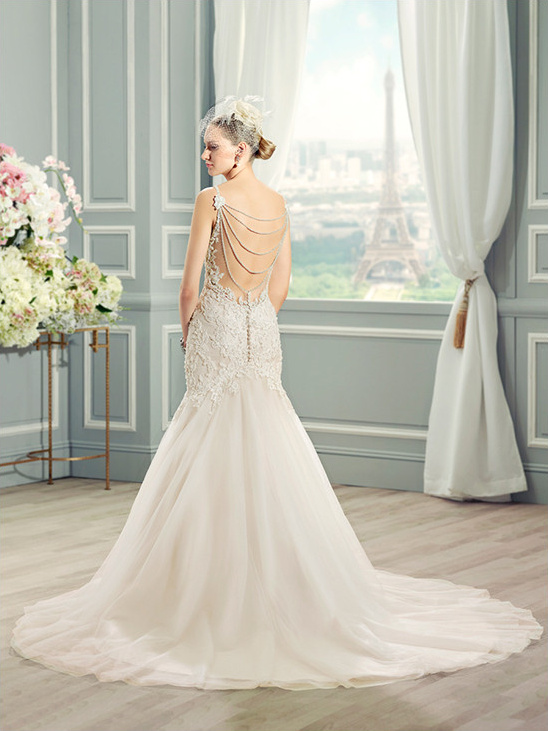 Elegant bride in a beautiful wedding dress with Paris view