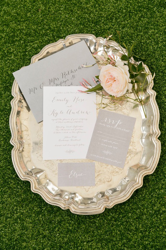 Elegant wedding stationary with flowers on a silver tray