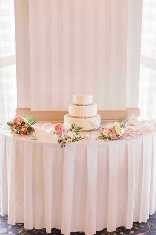 elegant flower covered cake table @weddingchicks