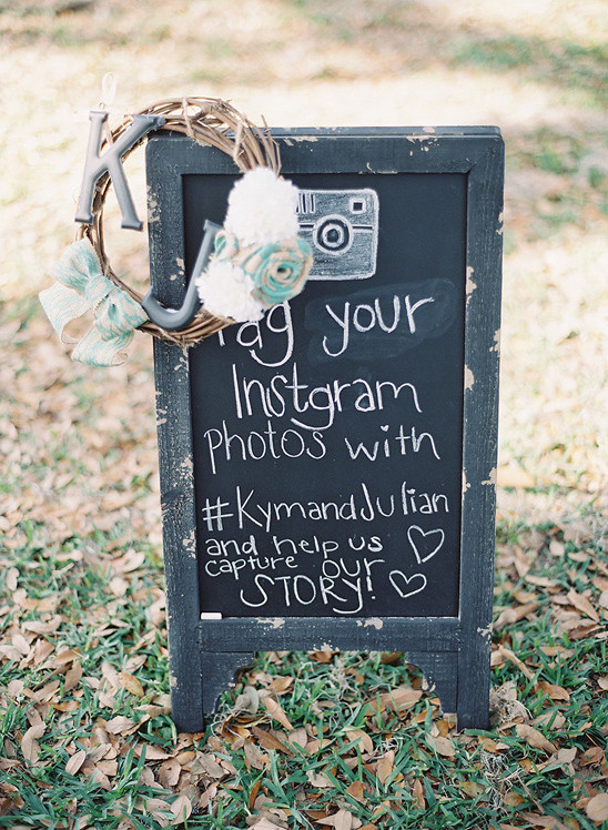 Rustic wedding sign asking guests to tag Instagram photos