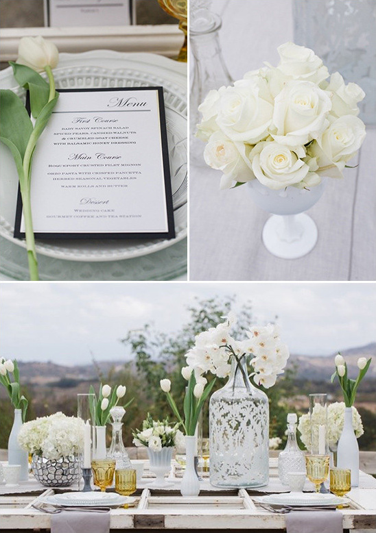 Elegant white wedding table setting with floral arrangements