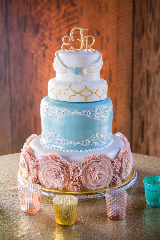 Elegant four tier wedding cake with floral decorations
