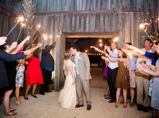 Wedding couple's sparkler send-off kiss
