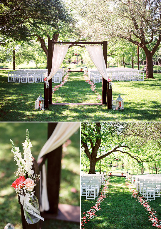 Outdoor wedding ceremony with wooden arch and white chairs