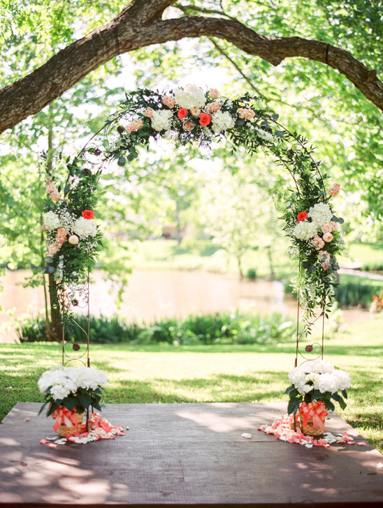 flower accented wedding arch @weddingchicks