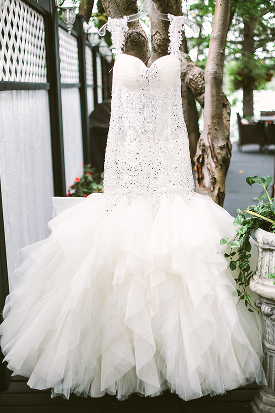 Elegant beaded mermaid wedding dress with ruffled skirt