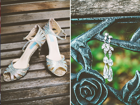 Elegant wedding shoes and earrings on a wooden bench