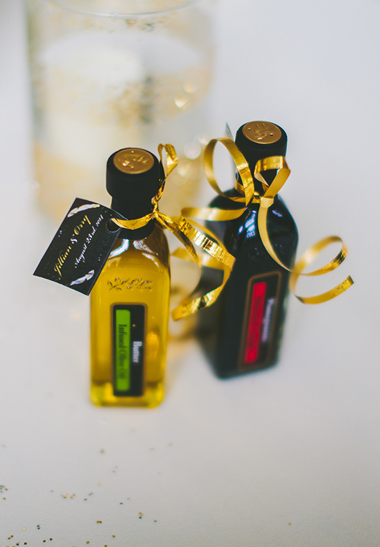 Gourmet oil bottle wedding favors with gold ribbon