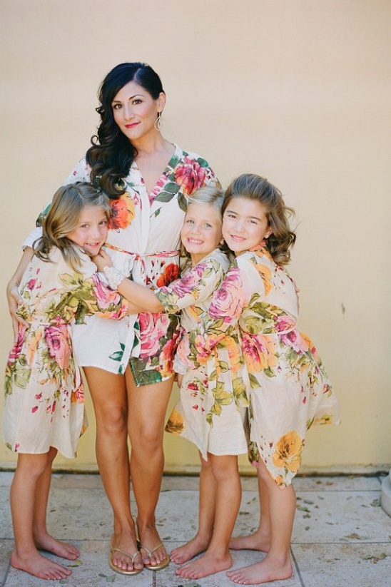 Mother and daughters in floral robes for wedding