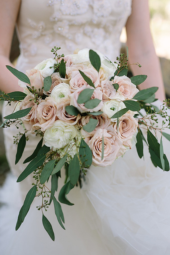 Bridal bouquet of pink and white roses with eucalyptus