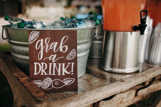 Grab a drink station with lemonade and bottled water