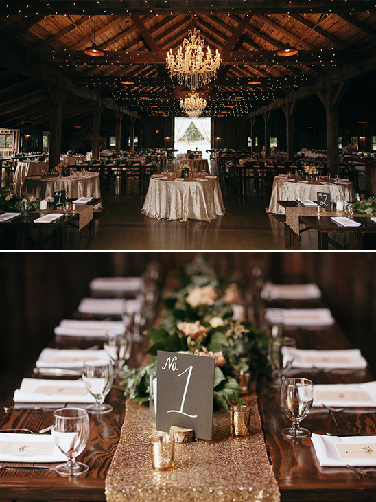 Rustic barn wedding reception with chandeliers and tables