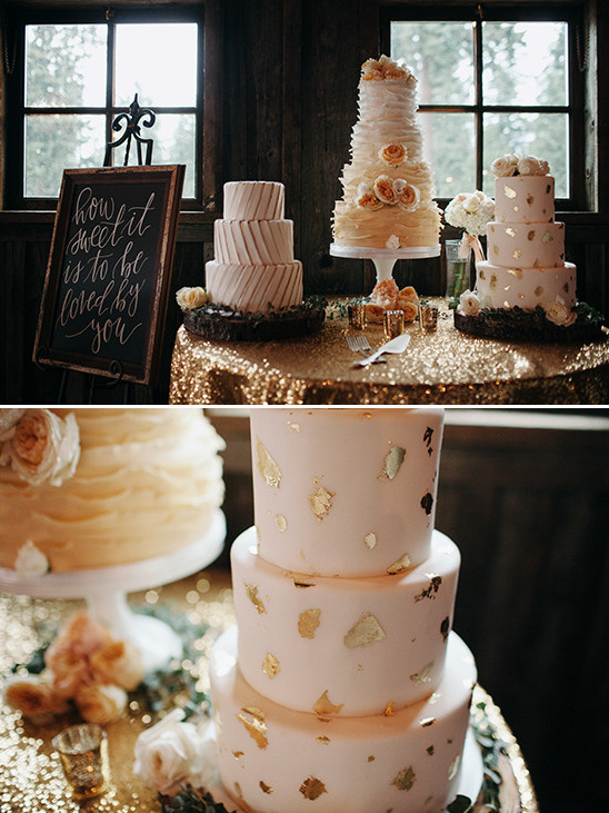 Elegant wedding cakes on a shimmering gold table display