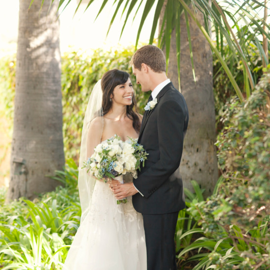 Bride and groom smiling at their outdoor wedding