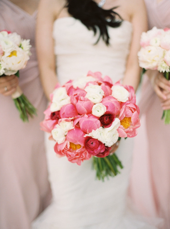 Bride holding a lovely pink and white peony bouquet