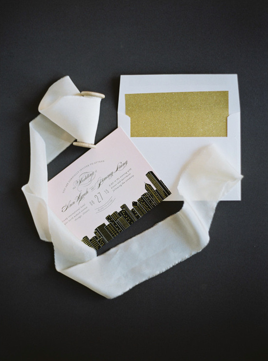 Elegant wedding invitation with city skyline design