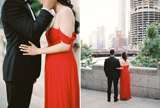 Elegant couple in red dress city skyline background