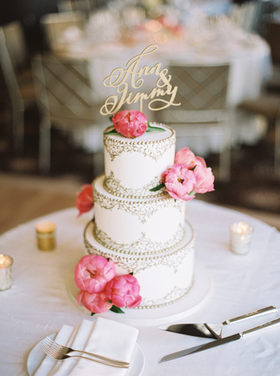 Three tier wedding cake with peonies and Anna Jimmy topper