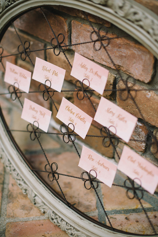 Wedding seating chart in framed floral wire display