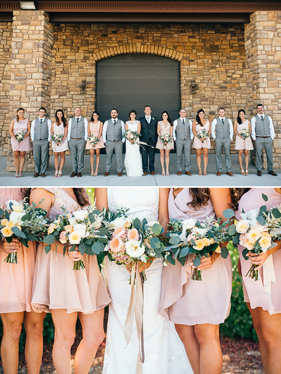 Wedding party in pink dresses and gray suits outdoors