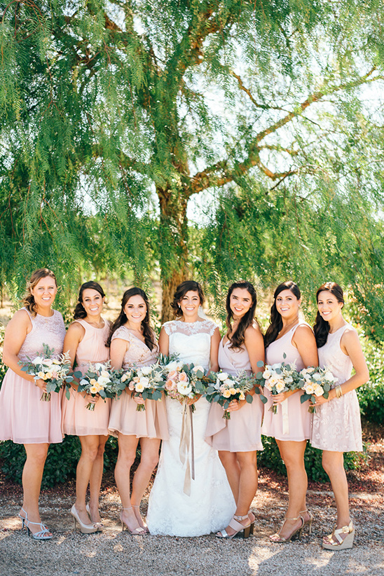 Bride and bridesmaids in pink dresses at a wedding