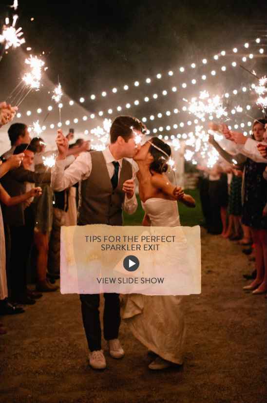 Newlyweds kiss during sparkler wedding exit