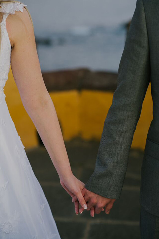 Bride and groom holding hands, wedding day bliss and love