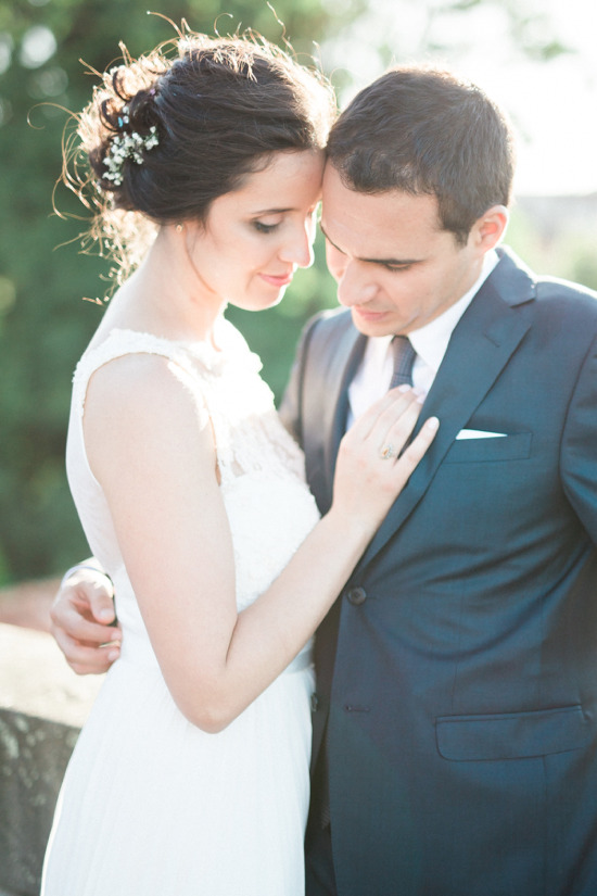 Loving bride and groom sharing a tender moment on their wedding day